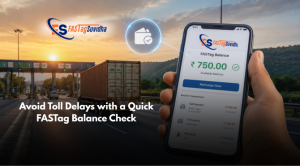 Hand holding a smartphone displaying the Fastag Suvidha app with FASTag balance on screen near an Indian toll plaza, illustrating online FASTag balance check and digital toll payment management.